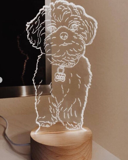 The Customized Pet Lamp Design features a decorative LED dog outline on a wooden base with a COCO tag, adding charm beside your custom pet canvas and brightening any light-colored surface.