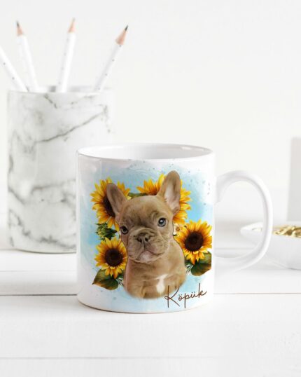 The Flower Wreath Custom Design Mug #1, featuring a French Bulldog with sunflowers, sits on a white desk by a marble pencil holder—ideal inspiration for custom pet canvas or personalized canvas printing.