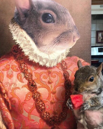 A squirrel sits before "The Noble Lady #4 - Custom Design Canvas," which features a dignified squirrel in ornate attire and ruff collar, while the real squirrel poses with watermelon, echoing the regal scene depicted on the canvas.