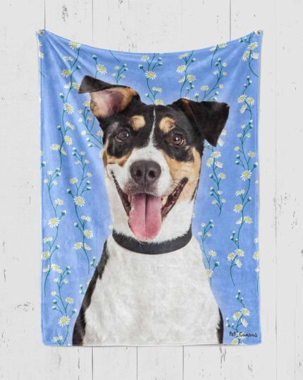 The Custom Pop Art Blanket – Floral Patterns showcases a cheerful black and white dog with a pink tongue on a light blue backdrop with white daisies—ideal for complementing your custom pet canvas decor.