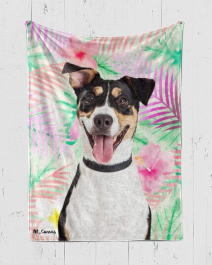 The Custom Pop Art Blanket – Floral Patterns showcases a cheerful black, white, and brown dog with its tongue out against vibrant pink and green tropical leaves—ideal for fans of unique pet canvas art.