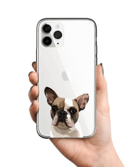A hand holds a Personalized Transparent Phone Case featuring a custom pet canvas illustration of a French Bulldog’s face. The iPhone is shown against a plain white background.