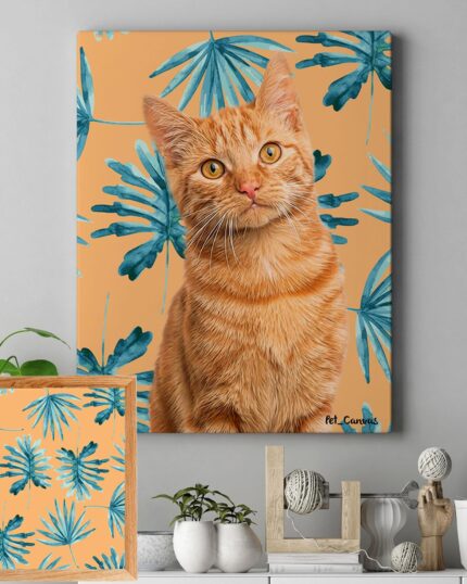 A wall features a Pop Art – Leaves custom pet canvas of an orange tabby cat on a peach background with blue-green leaves. Below, a framed Pop Art – Leaves print complements nearby plants and décor on a gray shelf.