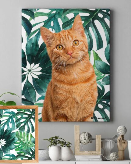 A Pop Art – Leaves custom pet canvas featuring an orange tabby cat hangs on a gray wall beside tropical leaves. Below, a shelf holds plants, decor, and artwork echoing the leafy background of the pet canvas.