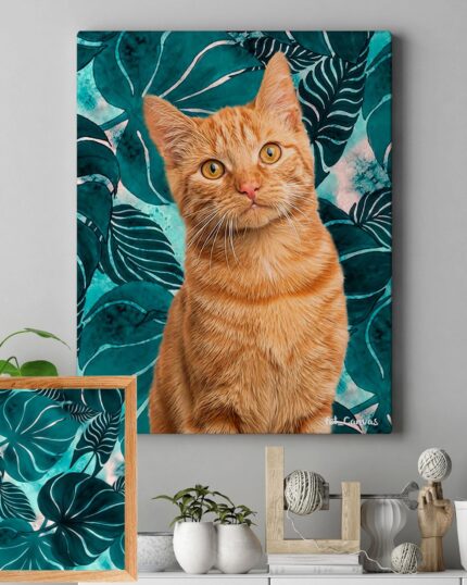 A framed “Pop Art – Leaves” custom pet canvas featuring a ginger cat with yellow eyes on a teal and green leafy background hangs above a modern shelf decorated with plants, small decor, and a matching leafy print.