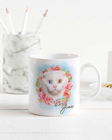 The Flower Wreath Custom Design Mug– no#7 features a white cat with one blue and one amber eye, surrounded by pink roses and greenery. “Yunos” is written below—an adorable tribute inspired by your beloved pet.