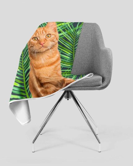 A gray swivel chair holds the Custom Design Pop-Art Blanket – Leaf #2, which displays a pet canvas design of an orange tabby cat with green palm leaves on white—ideal for fans of personalized pet decor.