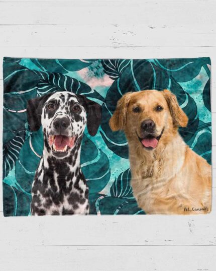 The Custom Design Pop-Art Blanket – Leaf #8 showcases playful Dalmatian and Golden Retriever illustrations with happy expressions on a teal leafy background, displayed atop a white wooden surface.