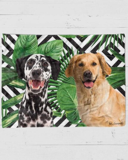 The Custom Design Pop-Art Blanket – Leaf #4 features illustrations of a smiling Dalmatian and golden retriever against a black-and-white geometric pattern with large green leaves, inspired by custom pet canvas art.