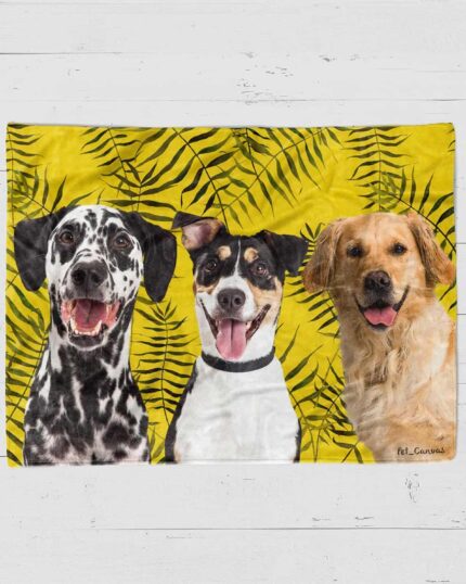 Three dogs—a Dalmatian, a black and white mixed breed, and a golden retriever—sit with happy expressions before a bright yellow background with black ferns, making the perfect scene for the Custom Design Pop-Art Blanket – Leaf #12.