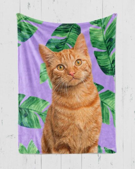 A realistic illustration of an orange tabby cat sits in front of green tropical leaves on a purple backdrop, displayed as a custom design pet canvas hanging against a white wooden wall.