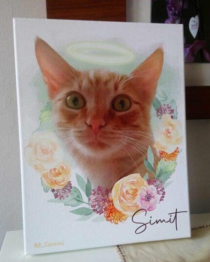 A painted portrait of an orange cat with a halo above its head, surrounded by pastel flowers. This custom design pet canvas features the name “Simit” in the bottom right corner of the artwork.