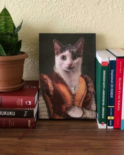 The Noble Lady #8 - Custom Design Pet Canvas featuring a cat in royal attire sits on a wooden shelf, placed between a potted plant and colorful books.