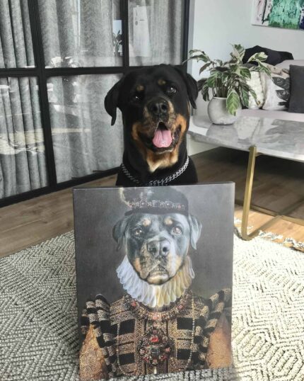 A joyful Rottweiler sits indoors behind "The Yellow Queen #7 - Custom Design Pet Canvas," featuring the dog in ornate royal attire, surrounded by plants and art in a modern living room, mouth open and tongue out.
