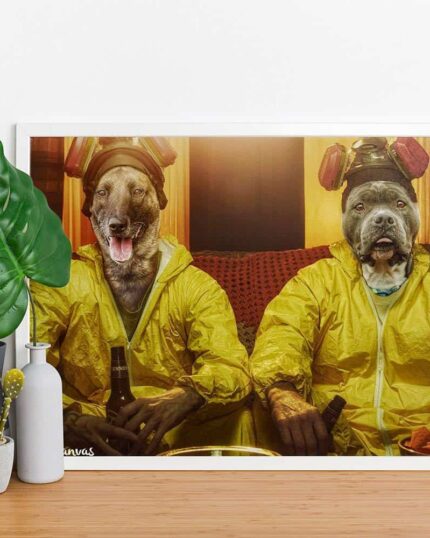 The Custom Design Canvas Painting – Series Character #7 – Breaking Bad features two dogs in yellow hazmat suits and gas masks sitting side by side on a couch. The framed art sits on a table with green potted plants and decorative bottles beside it.