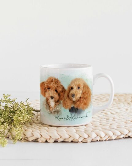 The Flower Wreath Custom Design Mug #6, featuring two brown poodles, rests on a woven placemat beside green flowers atop a white wooden surface, capturing the charm of personalized pet art.