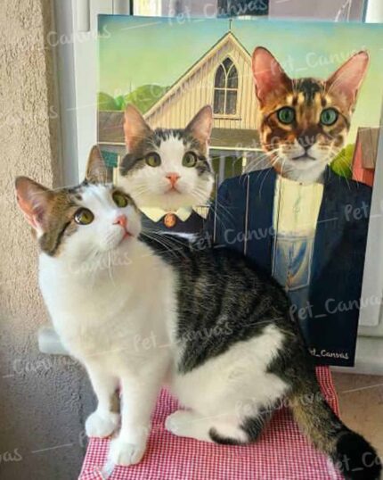 A cat sits on a red-checkered surface before a painting of two cats styled like American Gothic, showcasing "The American Buddies - Custom Design Pet Canvas.