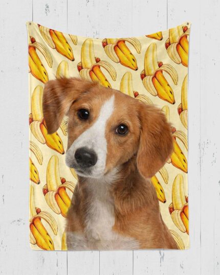 A brown and white dog tilts its head at the camera, set against a background of watermelon pop-art—an adorable custom design Pop-Art Blanket perfect for any space.
