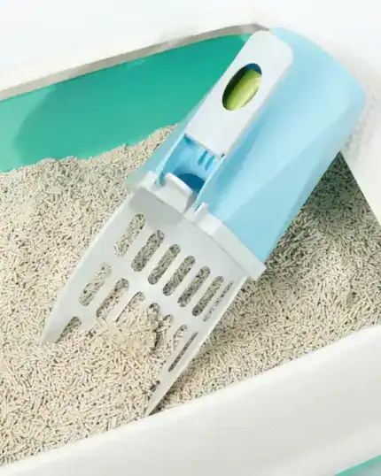 The LitterLux Advanced Cat Litter Scoop, featuring a built-in waste compartment, sits on clumping cat litter in a green and white box—perfect inspiration for your next custom design pet canvas.
