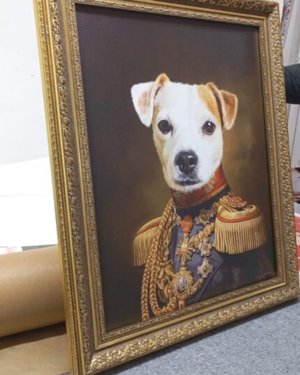 The General – Custom Design Pet Canvas features a pet, such as a dog, portrayed in an ornate military uniform with medals in a classical style. The gold-framed artwork sits on a gray surface with a utility knife beside it.