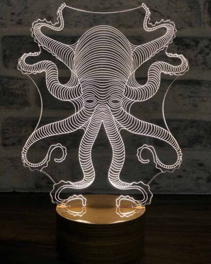 The 3D Octopus LED Night Lamp features a clear acrylic octopus design with glowing white lines on a round wooden base, making it an ideal accent beside your favorite pet canvas or custom pet canvas display.