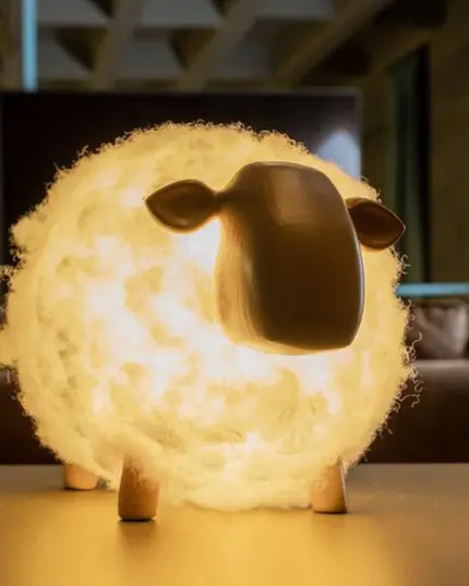 The Soft Cotton Sheep Night Light, with its glowing, fluffy body and minimalist face, sits on a table in a dim room, adding charm much like custom pet canvas art or elegant canvas printing.