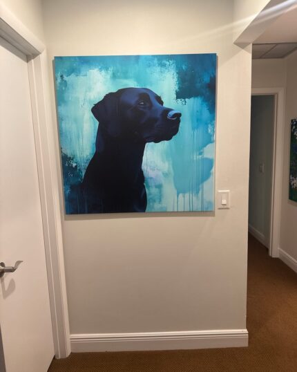 A Custom Design Abstract Pet Portrait of a black dog in profile hangs on a white hallway wall, featuring blue and teal abstract splashes for a modern, artistic touch.