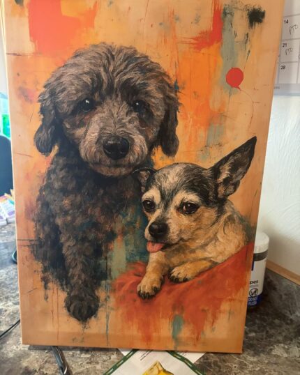 The Custom Design Abstract Pet Portrait shows two dogs—a fluffy black one and a small gray-and-white pup with its tongue out—on an orange and yellow abstract background, displayed on a countertop.