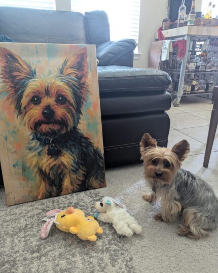 A small Yorkshire Terrier sits on a carpet next to plush toys, beside a colorful Custom Design Abstract Pet Portrait canvas. In the background are a black leather couch and bar cart, with sunlight streaming through the window.